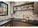 Stylish bar area features elegant countertop, open shelving, and space for beverage storage at 332 S Franklin St, Denver, CO 80209