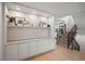Finished basement area with built-in storage, a staircase, and access to the lower level at 332 S Franklin St, Denver, CO 80209