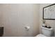 Powder room showcases a modern toilet and geometric wallpaper for a unique design touch at 332 S Franklin St, Denver, CO 80209