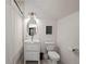Charming bathroom with a pedestal sink, modern fixtures, and framed mirror at 332 S Franklin St, Denver, CO 80209