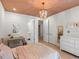 Stylish bedroom with connecting bathroom and stylish chandelier at 332 S Franklin St, Denver, CO 80209