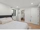 Comfortable bedroom featuring a closet, neutral decor, and plenty of natural light from the window at 332 S Franklin St, Denver, CO 80209