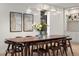 Elegant dining room with a long wooden table, comfortable seating, and stylish decor at 332 S Franklin St, Denver, CO 80209