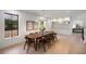 Formal dining room features hardwood floors, a stylish chandelier, and ample seating for ten at 332 S Franklin St, Denver, CO 80209
