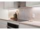 Modern kitchen features stainless steel appliances, sleek cabinetry, and a stylish countertop at 332 S Franklin St, Denver, CO 80209