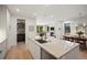 Open kitchen flows seamlessly into the living and dining areas, creating an ideal entertaining space at 332 S Franklin St, Denver, CO 80209