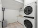Efficient laundry room with a stackable washer/dryer and countertop space at 332 S Franklin St, Denver, CO 80209