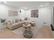 Cozy living room featuring a comfortable sectional sofa and textured rug at 332 S Franklin St, Denver, CO 80209