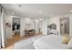 Spacious main bedroom with hardwood floors, seating area and a glimpse of a walk-in closet at 332 S Franklin St, Denver, CO 80209