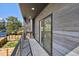 Private balcony with wood siding and metal railings, overlooking yard at 1248 N Tennyson St, Denver, CO 80204