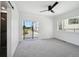 Spacious bedroom with sliding door to balcony and plush carpeting at 1248 N Tennyson St, Denver, CO 80204