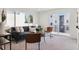 Cozy living room with dark sofa, sliding glass doors to balcony at 1248 N Tennyson St, Denver, CO 80204