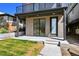 Ground level patio with brick exterior and modern door at 1248 N Tennyson St, Denver, CO 80204