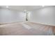 Finished carpeted basement features white walls with recessed lighting and a stairway at 17822 E 107Th Pl, Commerce City, CO 80022