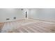 A carpeted unfinished basement featuring a window and access to another room at 17822 E 107Th Pl, Commerce City, CO 80022