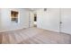 Bedroom featuring neutral carpet, white walls, natural light, and interior window at 17822 E 107Th Pl, Commerce City, CO 80022
