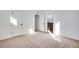 Bright bedroom with neutral carpet features white walls and an open ensuite bathroom at 17822 E 107Th Pl, Commerce City, CO 80022