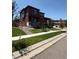Attractive two-story home featuring a covered front porch and well-maintained landscaping at 17822 E 107Th Pl, Commerce City, CO 80022