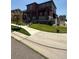 Beautiful two-story home with a covered porch, landscaped yard and a 'For Sale' sign at 17822 E 107Th Pl, Commerce City, CO 80022