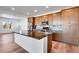 Bright kitchen with a large island, stainless steel appliances, and ample cabinet space at 17822 E 107Th Pl, Commerce City, CO 80022