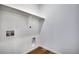 Small laundry room with connections for a washer and dryer, and overhead shelf at 17822 E 107Th Pl, Commerce City, CO 80022