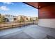 Spacious outdoor patio area with black metal railings, perfect for relaxation and enjoying the neighborhood views at 17822 E 107Th Pl, Commerce City, CO 80022