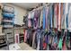 Organized walk-in closet providing ample storage space with rods and shelves, maximizing organization at 10265 Olathe St, Commerce City, CO 80022