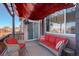 Inviting deck with awning, comfortable seating, and picturesque views of the neighborhood at 10265 Olathe St, Commerce City, CO 80022