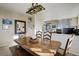 Dining area with rustic wood table, bench seating, and easy access to other living spaces at 10265 Olathe St, Commerce City, CO 80022