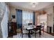 Dining area featuring a modern light fixture and bright windows at 10265 Olathe St, Commerce City, CO 80022