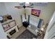 Elevated view of living room featuring a ceiling fan, high ceilings, and natural light at 10265 Olathe St, Commerce City, CO 80022