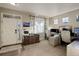 Home office with neutral walls, carpet, and a bright light from the large windows at 10265 Olathe St, Commerce City, CO 80022