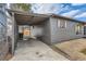 Carport on home featuring covered parking and gravel landscaping at 921 Meade St, Denver, CO 80204