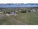 Spacious property featuring a large yard, two-story home, outbuildings and mature trees at 2996 Savage Rd, Elizabeth, CO 80107