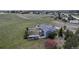 Aerial view of a home with a large fenced backyard and a playground at 2996 Savage Rd, Elizabeth, CO 80107