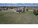 Aerial view of a two-story home and large lot with mature trees in a rural neighborhood at 2996 Savage Rd, Elizabeth, CO 80107