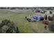 Aerial view of property featuring a large fenced backyard, outbuildings and a playground at 2996 Savage Rd, Elizabeth, CO 80107