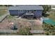 Aerial view of backyard with a deck, patio, storage shed, play set, and white picket fence at 2996 Savage Rd, Elizabeth, CO 80107