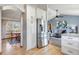 Modern kitchen with stainless steel refrigerator, granite countertops and adjacent dining room at 2996 Savage Rd, Elizabeth, CO 80107