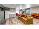 Spacious living area with a fireplace, comfortable seating, and a convenient kitchenette at 2996 Savage Rd, Elizabeth, CO 80107