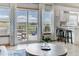Open living space with access to deck through sliding glass doors and adjacent kitchen at 2996 Savage Rd, Elizabeth, CO 80107