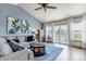 Cozy living room with vaulted ceilings, large windows, and access to the deck at 2996 Savage Rd, Elizabeth, CO 80107