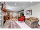 Inviting living room featuring a stone fireplace, wood floors, and comfortable seating at 2996 Savage Rd, Elizabeth, CO 80107