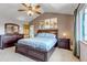 Spacious main bedroom features vaulted ceilings, ceiling fan, and ensuite bathroom access at 2996 Savage Rd, Elizabeth, CO 80107