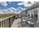 Outdoor dining space on a spacious deck showcases scenic views and natural light at 2996 Savage Rd, Elizabeth, CO 80107