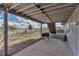 Covered patio with a barbecue grill and string lights, ideal for outdoor entertaining at 2996 Savage Rd, Elizabeth, CO 80107