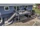 Two-level deck with outdoor seating and a grill, perfect for entertaining at 2996 Savage Rd, Elizabeth, CO 80107