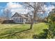 Spacious backyard showcasing a well-maintained lawn and mature tree at 1292 W 133Rd Cir, Westminster, CO 80234