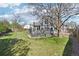 Lush backyard with a deck, manicured lawn, and a lovely tree at 1292 W 133Rd Cir, Westminster, CO 80234