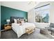 Bright bedroom with a large window, green accent wall, and vaulted ceilings at 1292 W 133Rd Cir, Westminster, CO 80234